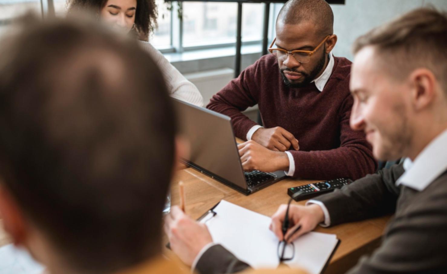 Professional reviewing financial reports and data